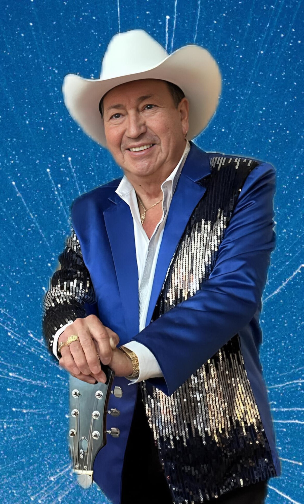 Sal Santiago in blue sequined jacket and cowboy hat with guitar